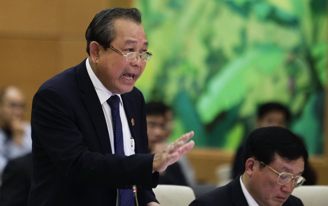 Chánh án toà án nhân dân tối cao Trương Hoà Bình trả lời chất vấn của các đại biểu quốc hội - Ảnh: Nguyễn Khánh