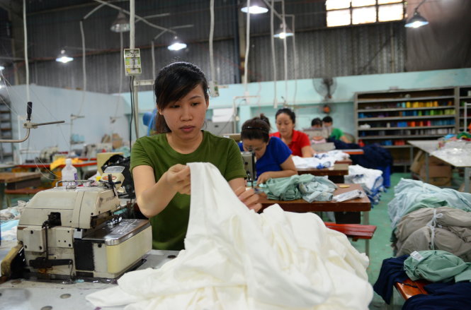 Doanh nghiệp mong muốn lãi suất cho vay ổn định, không tăng theo lãi suất huy động - Ảnh: Hữu Khoa