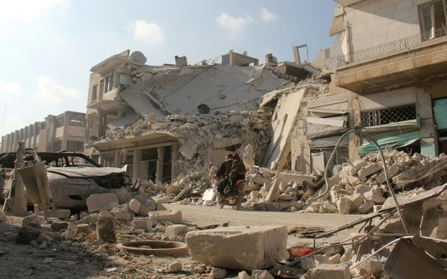 Một khu vực thuộc tỉnh Idlib của Syria ngày 21-12 sau các vụ không kích của Nga - Ảnh: AFP