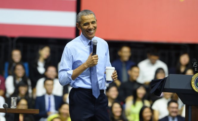 Nụ cười sảng khoái của ông Obama trong phần hỏi đáp với bạn trẻ - Ảnh: THUẬN THẮNG