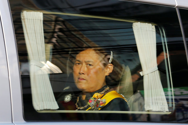 Thailand's Princess Maha Chakri Sirindhorn looks out from a van as a motorcade transports the body of Thailand's late King Bhumibol Adulyadej from the Bangkok hospital to the Grand Palace in Bangkok