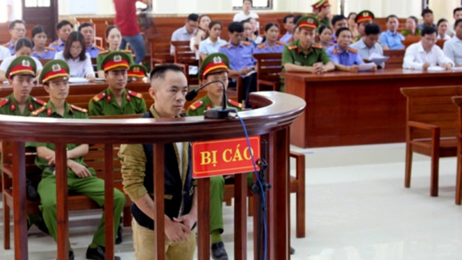 Đối tượng Nguyễn Văn Nam tại phiên tòa sáng 20-4 - Ảnh: H.S