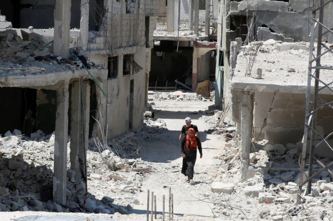 Syria hoang tàn vì bom đạn của các bên - Ảnh: Reuters