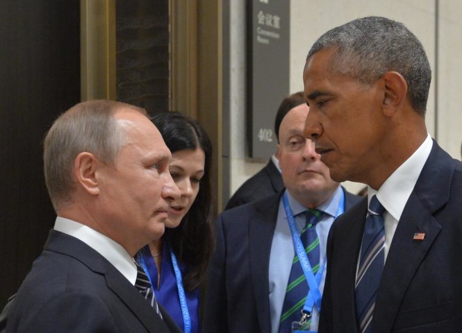 Tổng thống Nga Vladimir Putin (trái) và cựu tổng thống Mỹ Barrack Obama (phải) - Ảnh: AFP