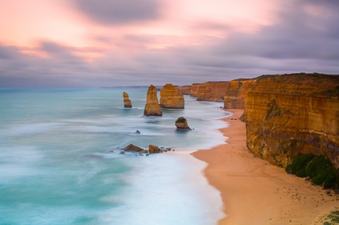 Head off on a road trip along Australia's Great Ocean Road and be sure to get a head start on the driving just as the sun comes up, captured here from the Twelve Apostles Marine National Park© Getty Images