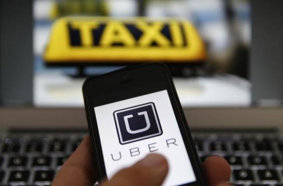 Ảnh đồ họa của Reuters minh họa ứng dụng di động Uber đặt xe, trong đó bao gồm xe taxi - Ảnh: Reuters