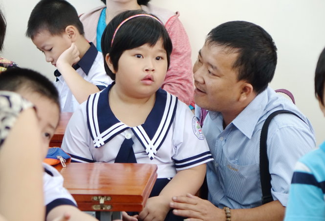 Phụ huynh và học sinh lớp 1 trong ngày tựu trường năm học mới 2014-2015 tại Trường tiểu học Nguyễn Văn Trỗi, Q.Tân Bình, TP.HCMẢnh: Như Hùng