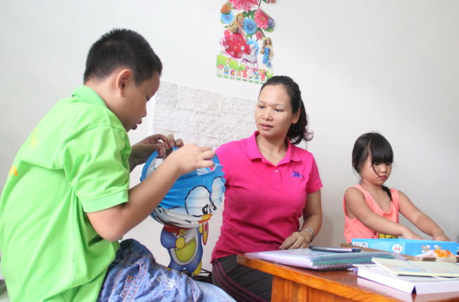 Thanh Huyền và hai con trong mái ấm nhỏ ở Trường ĐH Thể dục thể thao trung ương 2 (TP.HCM) - Ảnh: H.Đ.