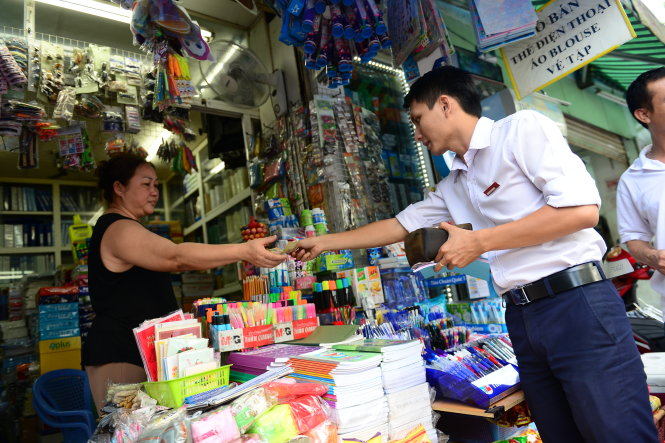 Các chuyên gia cho rằng cần có chính sách khuyến khích người dân mua hàng lấy hóa đơn như cách các nước khác đã làmẢnh: Quang Định