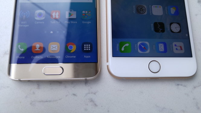 Cả hai smartphone đều tích hợp cảm biến nhận dạng dấu vân tay ở nút Home trên thân máy. Đáng chú ý, công nghệ nhận dạng trong iPhone 6S Plus được nâng cấp, thời gian nhận dạng dấu vân tay rất nhanh (trong khoảng hơn một giây). Galaxy S6 Edge+ cũng cải tiến tốc độ nhận diện đồng thời hỗ trợ nhiều tài khoản dấu vân tay - Ảnh: Thanh Trực