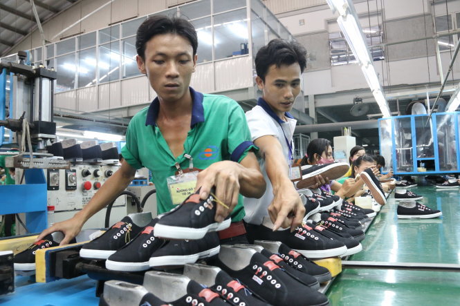 Sản xuất giày xuất khẩu sang thị trường Mỹ tại Công ty cổ phần công nghiệp Đông Hưng (thị xã Dĩ An, Bình Dương) - Ảnh: Tiến Long