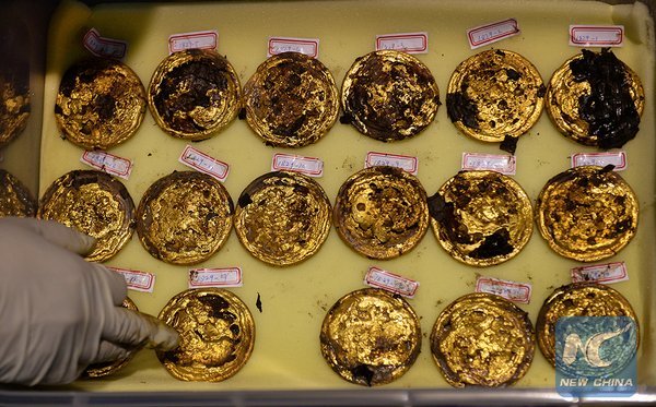 Mỗi đồng tiền vàng nặng khoảng 250 gram - Ảnh: Global Times