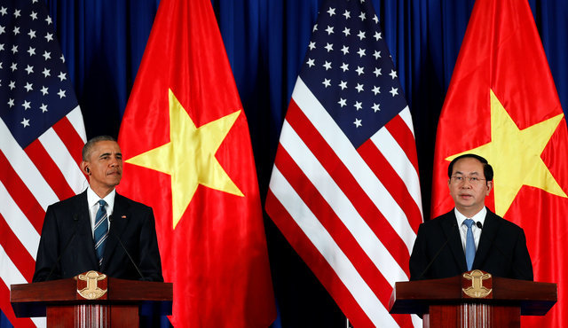 Chủ tịch nước Trần Đại Quang và Tổng thống Obama tại họp báo - Ảnh: Reuters.