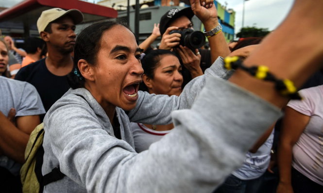 Nhiều cuộc biểu tình và cướp bóc đã nổ ra tại Venezuela sau khi nước này rơi vào khủng hoảng trầm trọng - Ảnh: AFP