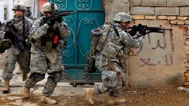 Các binh sĩ Mỹ trong một chiến dịch tại Iraq. Gần đây, các binh sĩ Mỹ bắt đầu quay trở lại chiến trường Trung Đông trong vai trò cố vấn hoặc trực tiếp tham gia hỗ trợ binh sĩ địa phương - Ảnh: AFP