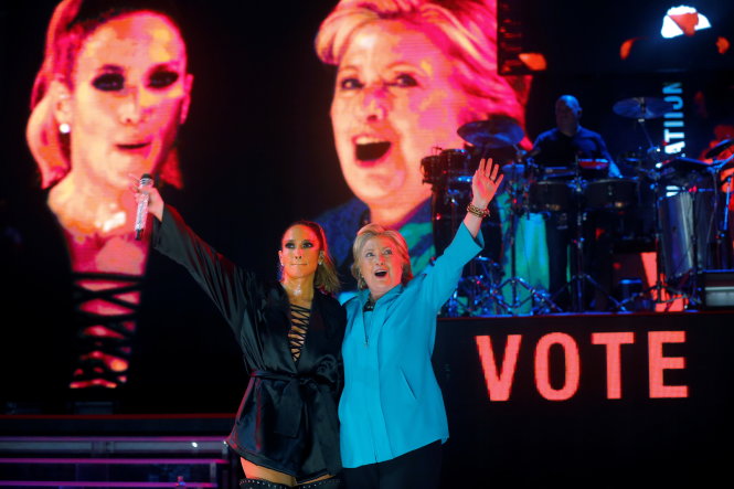 U.S. Democratic presidential nominee Hillary Clinton joins performer Jennifer Lopez at a campaign concert in Miami, Florida, U.S. October 29