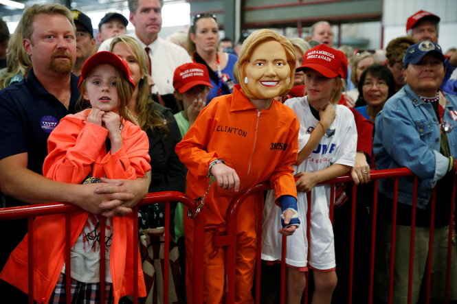 A child is pictured in a Hillary Clinton outfit as Republican presidential nominee Donald Trump speaks at a campaign event in Golden, Colorado, U.S. October 29