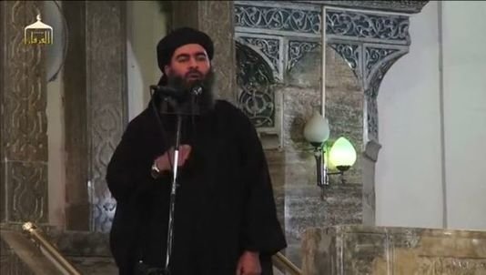 Thủ lĩnh của IS xuất hiện trong lần đầu trên đài Al-Furqan vào tháng 7-2014 - Ảnh: AFP