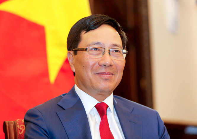 Phó Thủ tướng, Bộ trưởng Ngoại giao Phạm Bình Minh, trả lời báo chí tại Văn phòng Chính phủ sáng 5-1 - Ảnh: VIỆT DŨNG