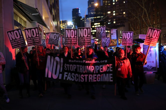 People rally against U.S. president-elect Donald Trump outside Trump International Hotel and Tower at Columbus Circle in Manhattan, New York City, U.S., January 19, 2017.