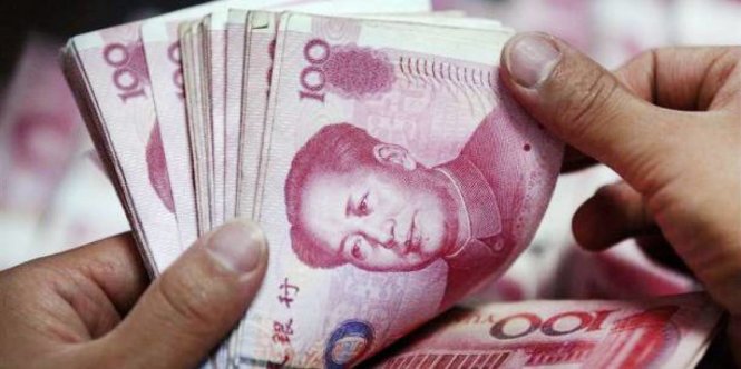 Đồng tiền Trung Quốc bị điều chỉnh không đúng theo giá trị thị trường khiến nhà đầu tư lo lắng, điều chỉnh hướng đầu tư - Ảnh: Reuters