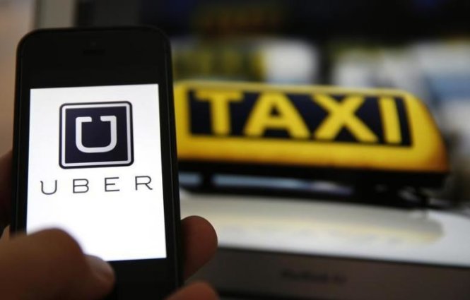 Ứng dụng Uber trên điện thoại di động - Ảnh: Reuters