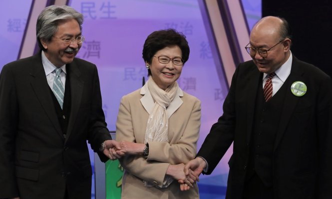 Từ trái qua, 3 ứng cử viên sẽ cùng tranh cử trong cuộc bầu chọn trưởng đặc khu hành chính Hong Kong ngày 26-3: Ông John Tsang, bà Carrie Lam và ông Woo Kwok-hing - Ảnh: AP