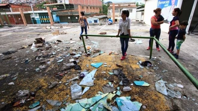 Nhiều cửa hàng ở bang Tachira bị cướp phá - Ảnh: AFP