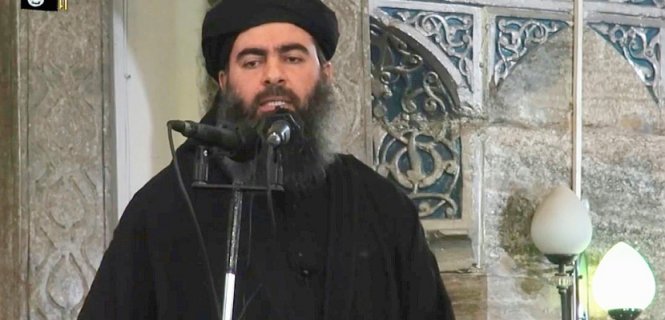 Tên giáo sĩ Abu Bakr al-Baghdadi trong một lần xuất hiện hiếm hoi - Ảnh: AFP