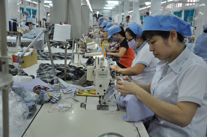 Sản xuất hàng dệt may xuất khẩu của Công ty CP may Bình Minh, một trong những doanh nghiệp của Vinatex - Ảnh: T.V.N.