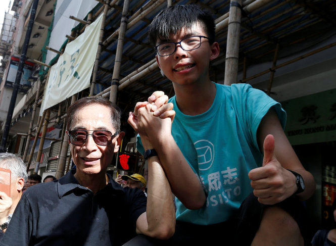 Hoàng Chi Phong xuất hiện trong cuộc biểu tình ngày 1-7 - Ảnh: Reuters