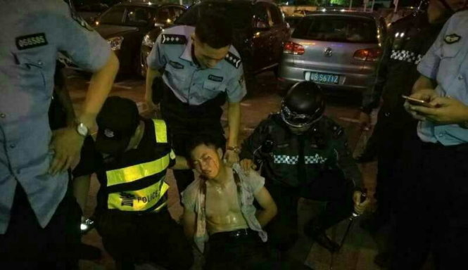 Nghi can vụ tấn công bị cảnh sát bắt giữ - Ảnh: People's Daily