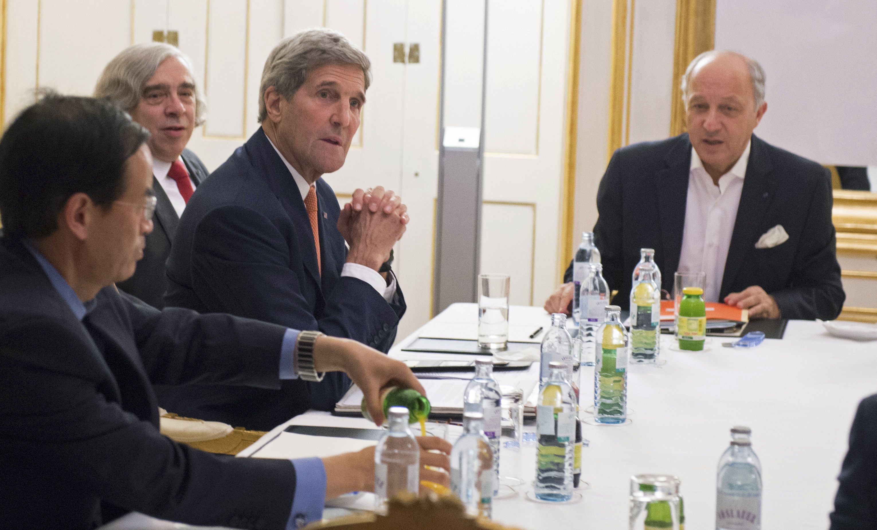 U.S. Secretary of State John Kerry (3rd R), U.S. Secretary of Energy Ernest Moniz (2nd R) and French Foreign Minister Laurent Fabius (R) meet at the Palais Coburg, the venue for nuclear talks in Vienna, Austria July 14, 2015. Iran has accepted a so-called 