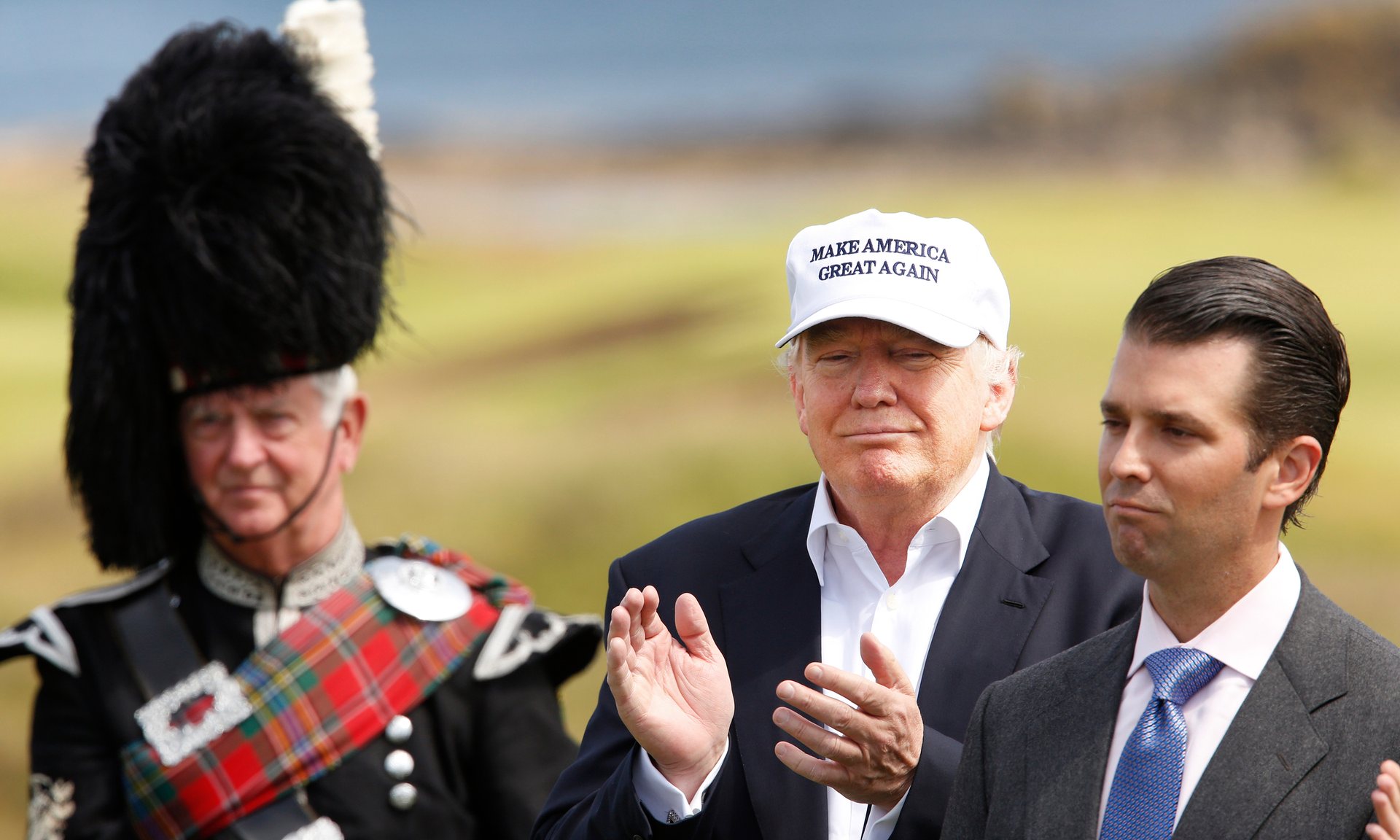Ông Donald Trump cùng con trai Donald Jr. khai trương khách sạn và sân gôn ở Ayrshire, Scotland - ảnh: Guardian