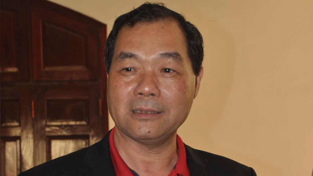 Ông Trầm Bê, khi còn là Phó chủ tịch Hội đồng quản trị Ngân hàng Sacombank, trong một lần trả lời phỏng vấn báo chí năm 2012 - Ảnh: Quang Định